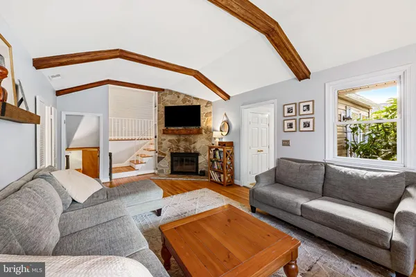 a living room with furniture or couch and a flat screen tv