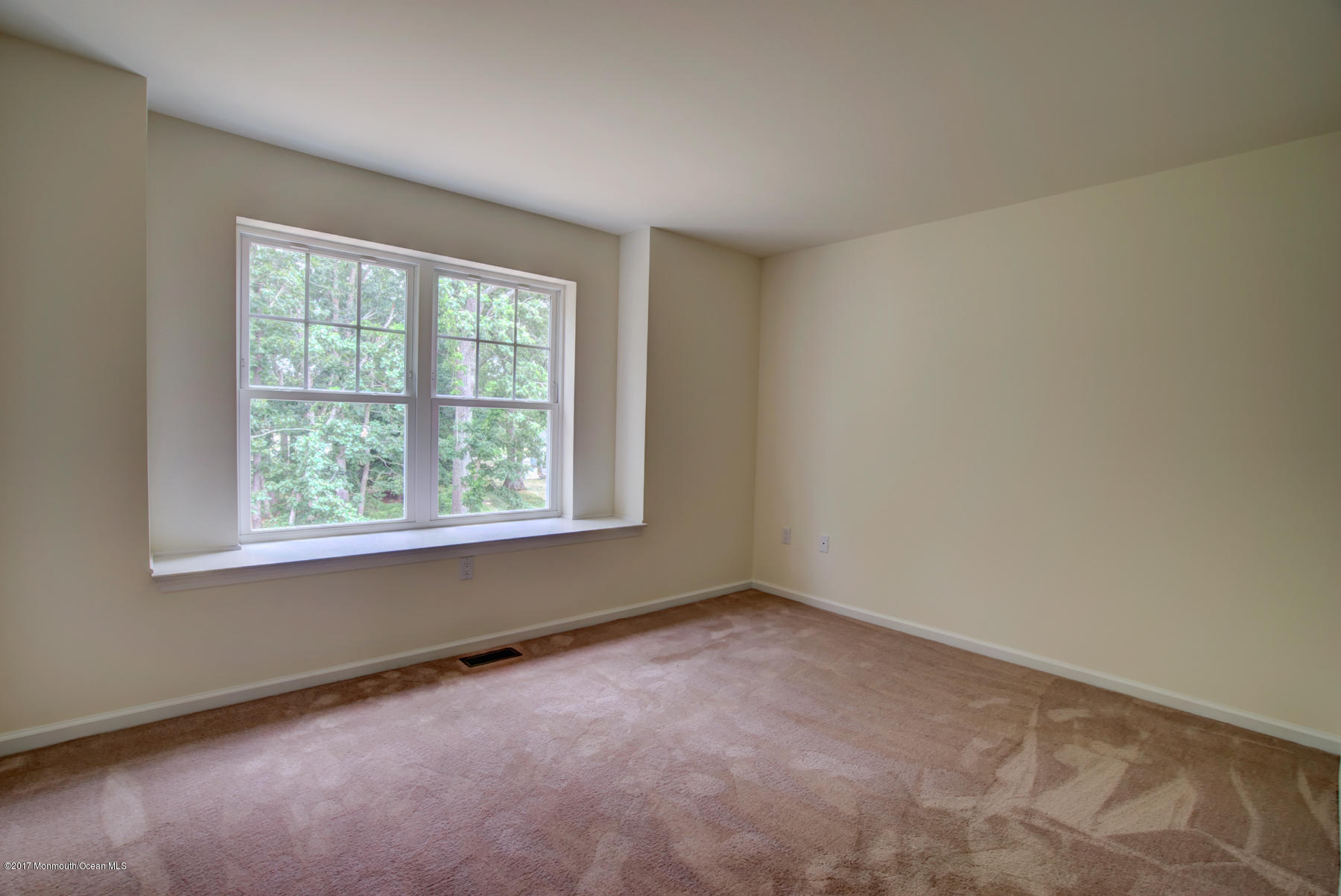 57 Rockingham Way Manchester Township, NJ 08759 - Photo 14 of 17 an empty room with a window