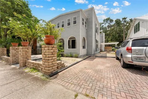 a front view of a house with parking area
