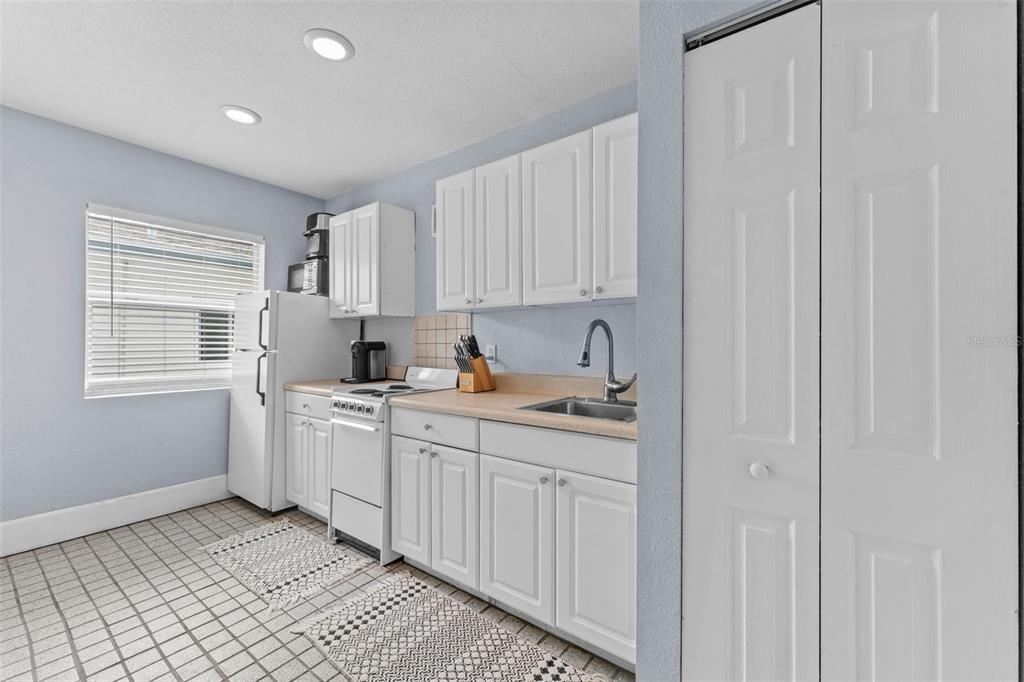 1326 17th Terrace North St. Petersburg, FL 33704 - Photo 18 of 28 a kitchen with sink cabinets and window