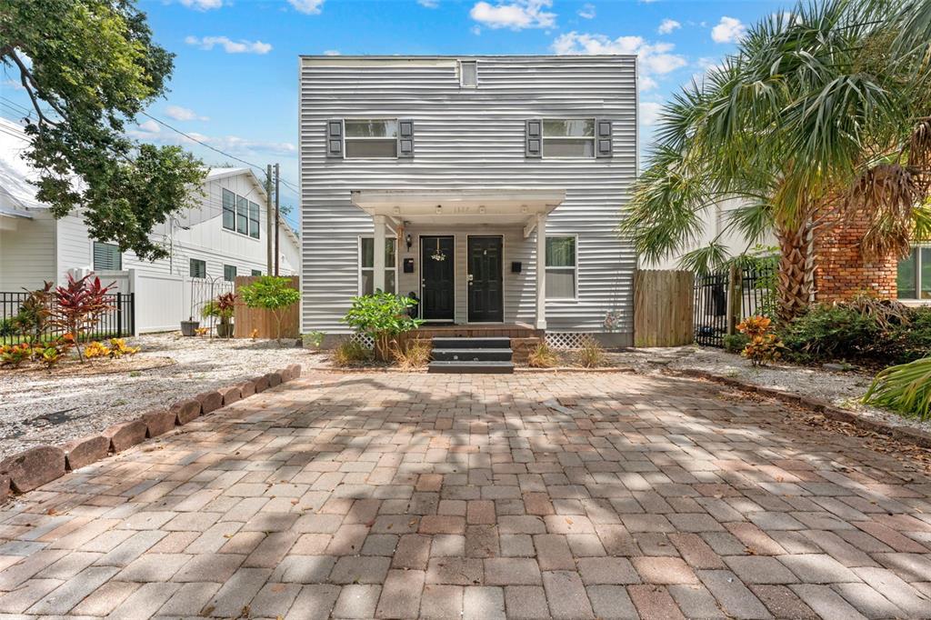 1326 17th Terrace North St. Petersburg, FL 33704 - Photo 3 of 28 a front view of a house with a yard