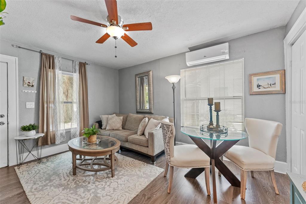 1326 17th Terrace North St. Petersburg, FL 33704 - Photo 5 of 28 a living room with furniture wooden floor and a chandelier