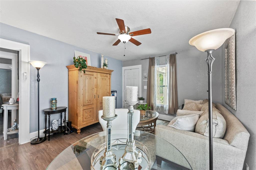 1326 17th Terrace North St. Petersburg, FL 33704 - Photo 6 of 28 a living room with furniture and a chandelier