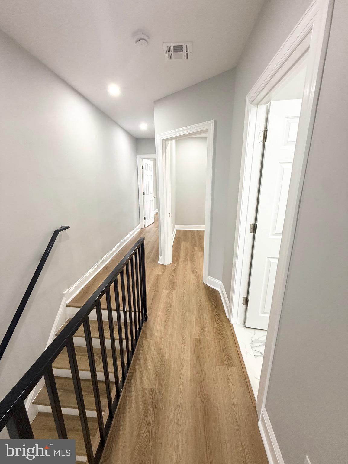 355 East Loudon Street Philadelphia, PA 19120 - Photo 21 of 30 a view of a hallway with wooden floor and staircase