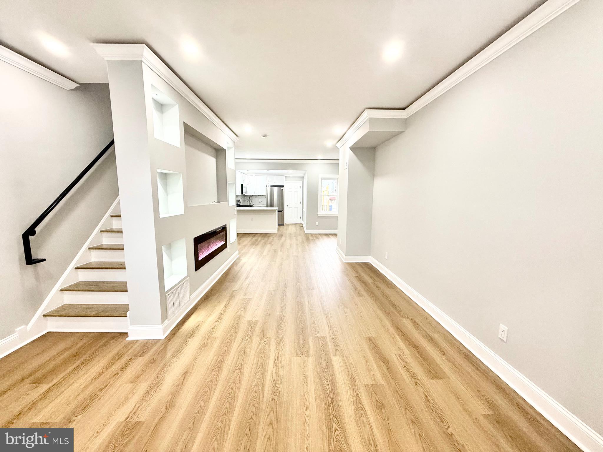 355 East Loudon Street Philadelphia, PA 19120 - Photo 4 of 30 a view of a hallway with wooden floor and staircase