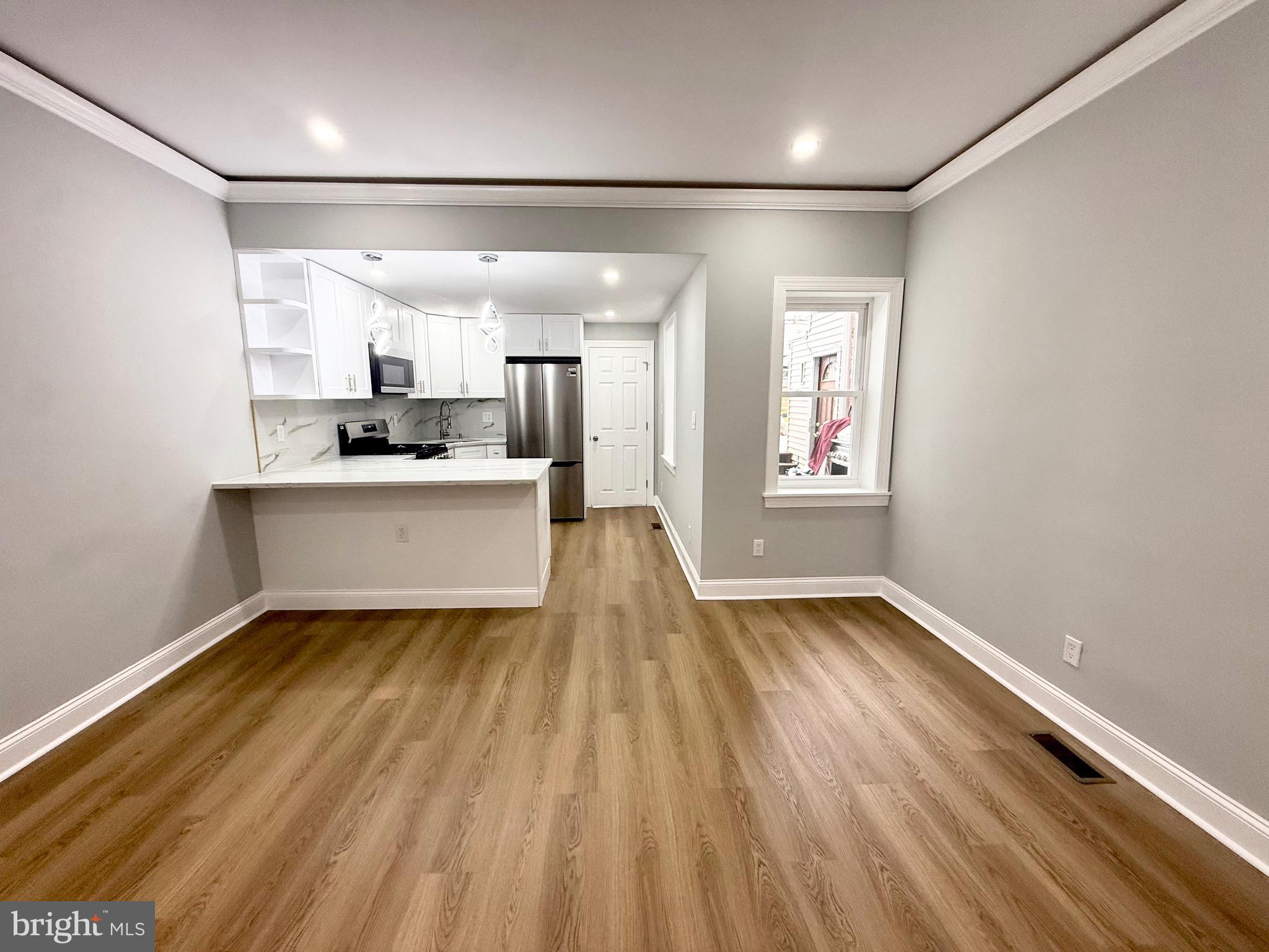 355 East Loudon Street Philadelphia, PA 19120 - Photo 7 of 30 a view of a big room with wooden floor and windows