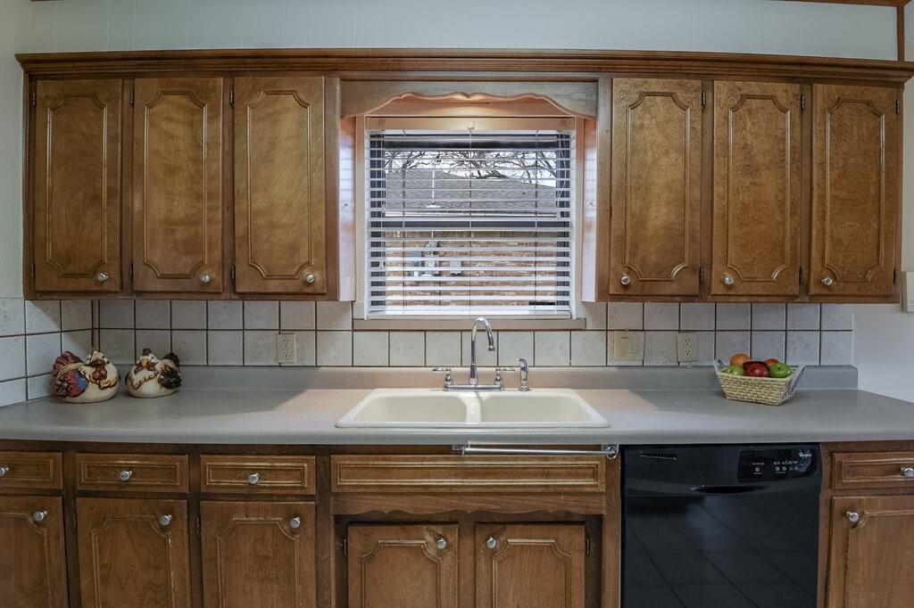 1609 Delta Drive Arlington, TX 76012 - Photo 12 of 28 a view of a kitchen with a sink and cabinets