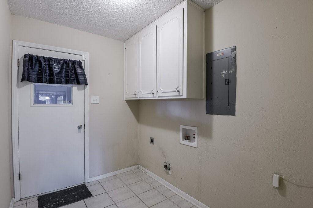 1609 Delta Drive Arlington, TX 76012 - Photo 15 of 28 a view of storage and utility room with washer and dryer