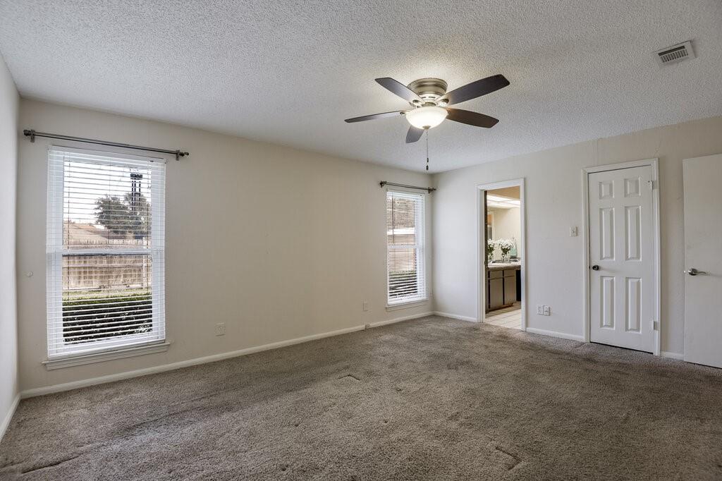 1609 Delta Drive Arlington, TX 76012 - Photo 17 of 28 a view of an empty room with a window
