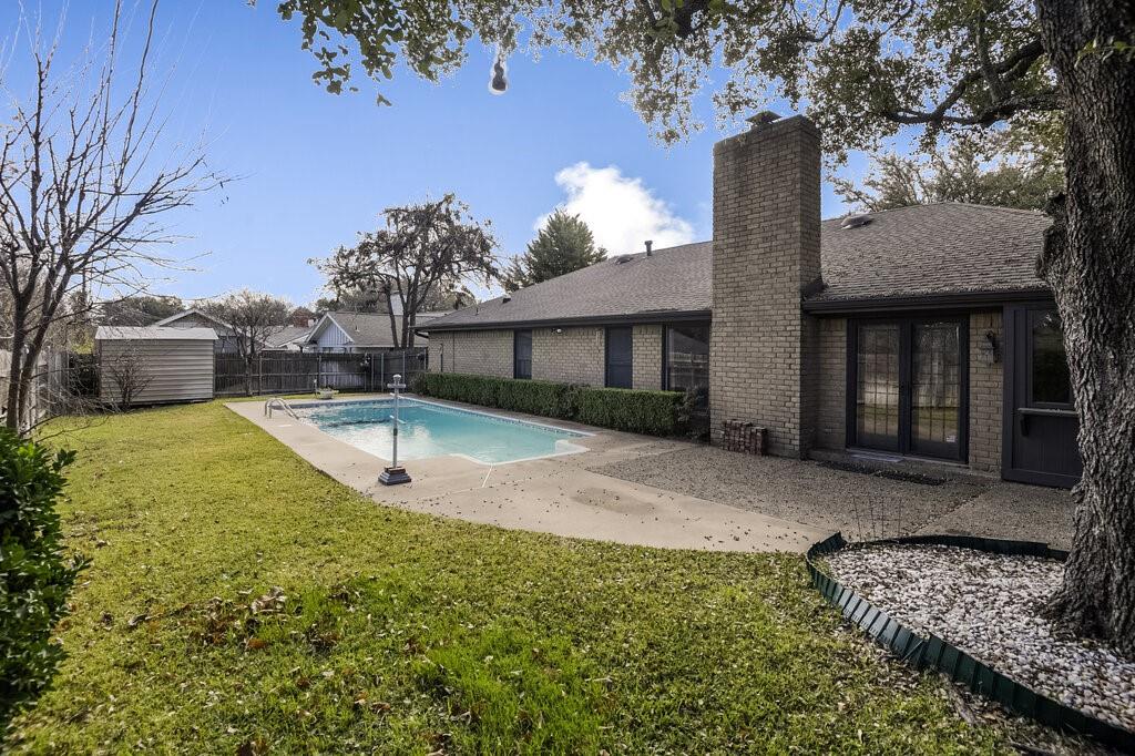 1609 Delta Drive Arlington, TX 76012 - Photo 24 of 28 a view of a house with backyard and sitting area