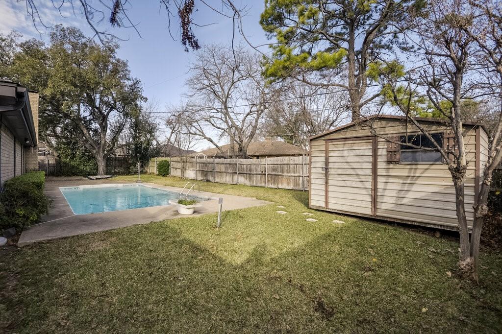 1609 Delta Drive Arlington, TX 76012 - Photo 27 of 28 a view of backyard with swimming pool