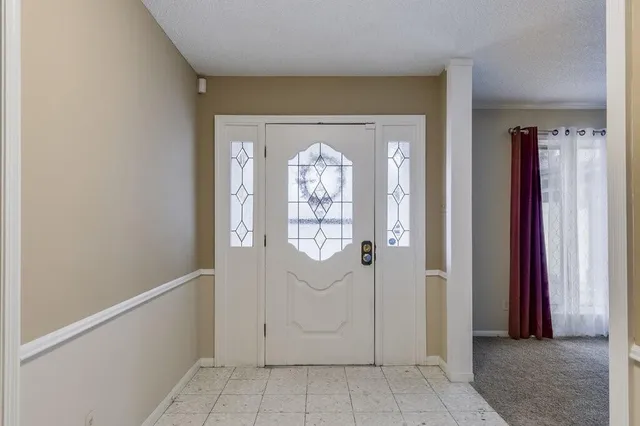 a view of a hallway with windows