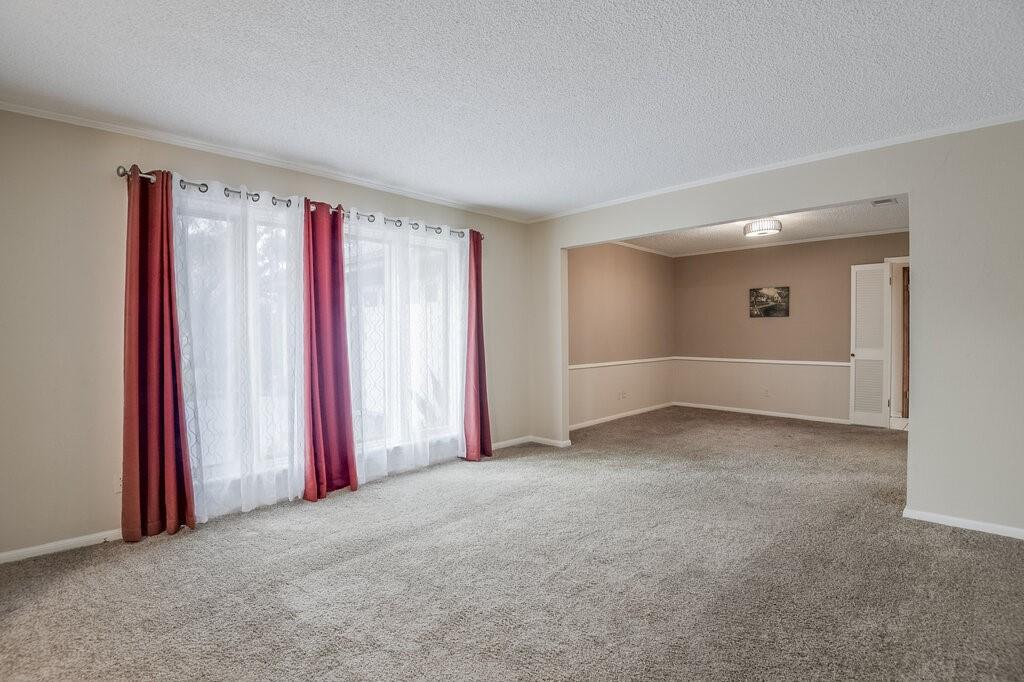 1609 Delta Drive Arlington, TX 76012 - Photo 4 of 28 a view of a livingroom with a staircase