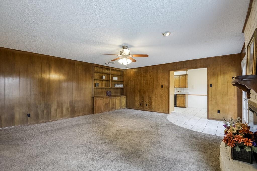1609 Delta Drive Arlington, TX 76012 - Photo 7 of 28 a view of a livingroom with a chandelier