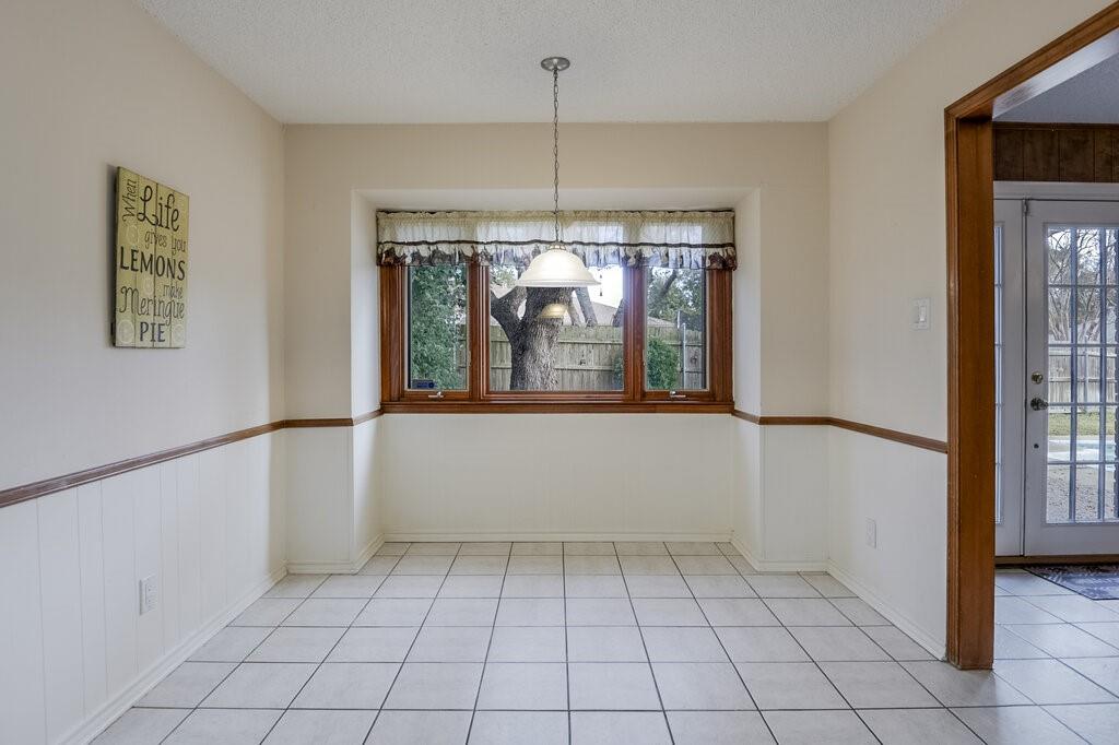 1609 Delta Drive Arlington, TX 76012 - Photo 10 of 28 a view of an empty room with window and chandelier