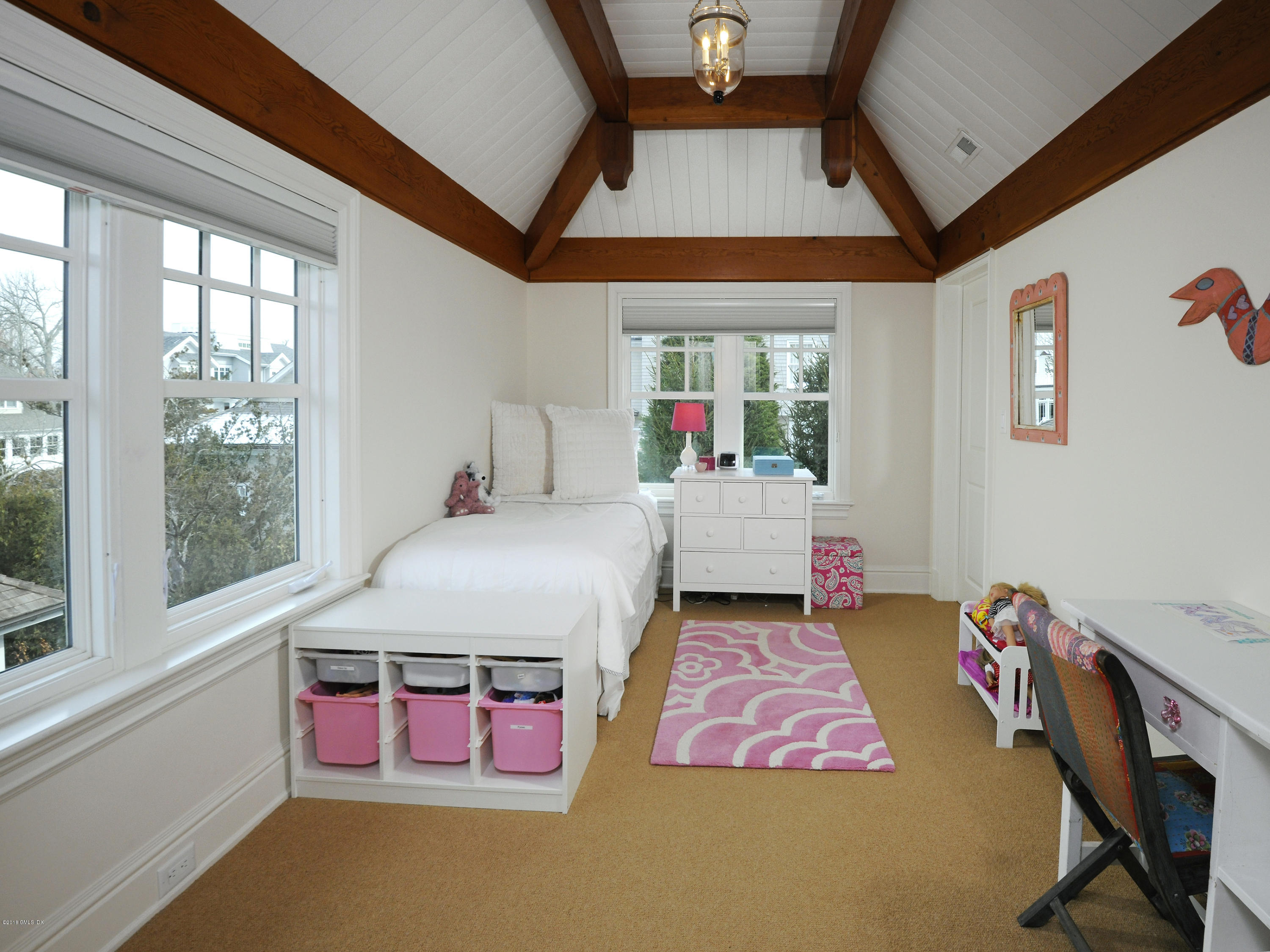 12 Ledge Road Old Greenwich, CT 06870 - Photo 20 of 34 a bed room with a bed next to a window