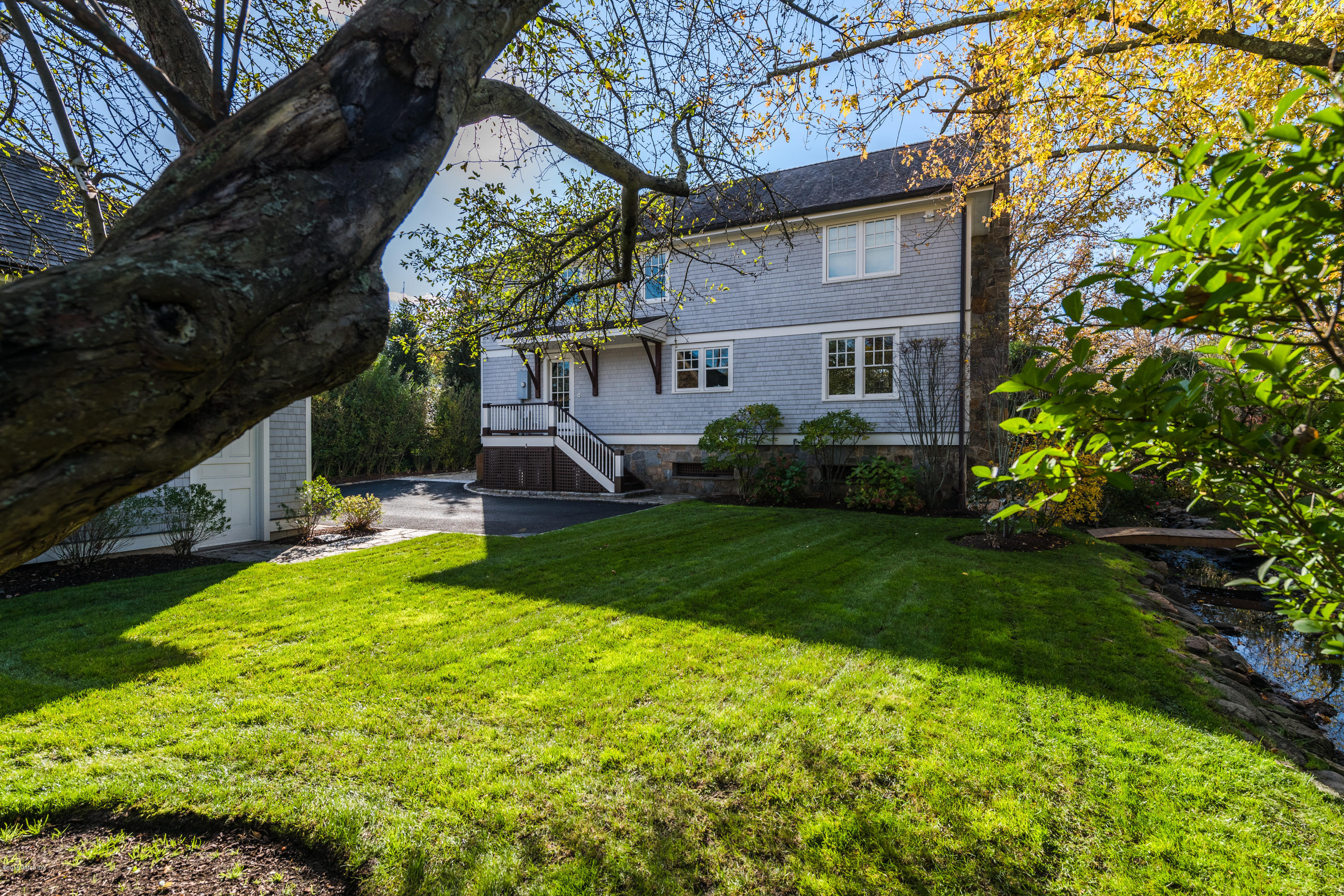 12 Ledge Road Old Greenwich, CT 06870 - Photo 27 of 34 a view of house with a yard