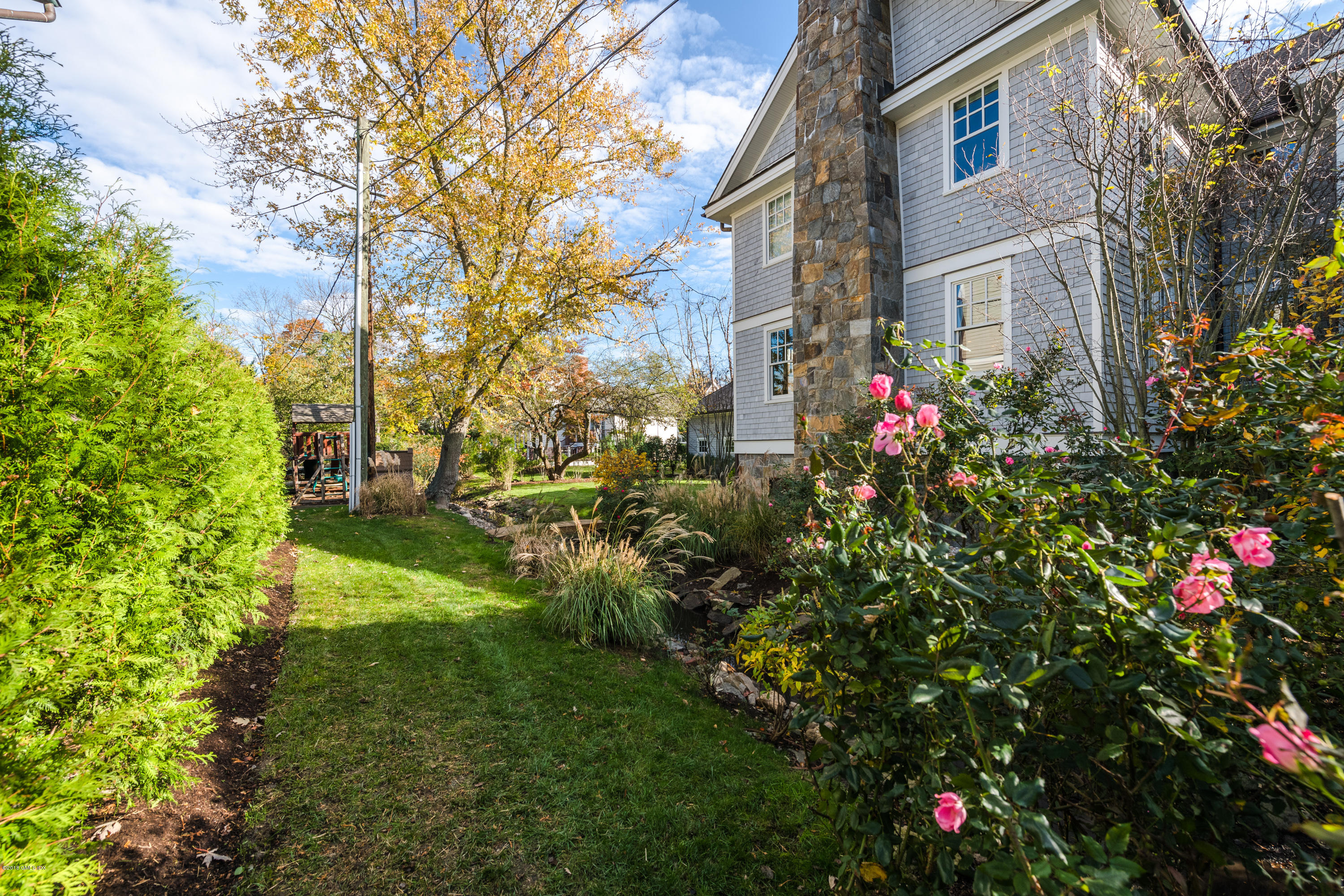 12 Ledge Road Old Greenwich, CT 06870 - Photo 28 of 34 a view of a house with a yard and garden