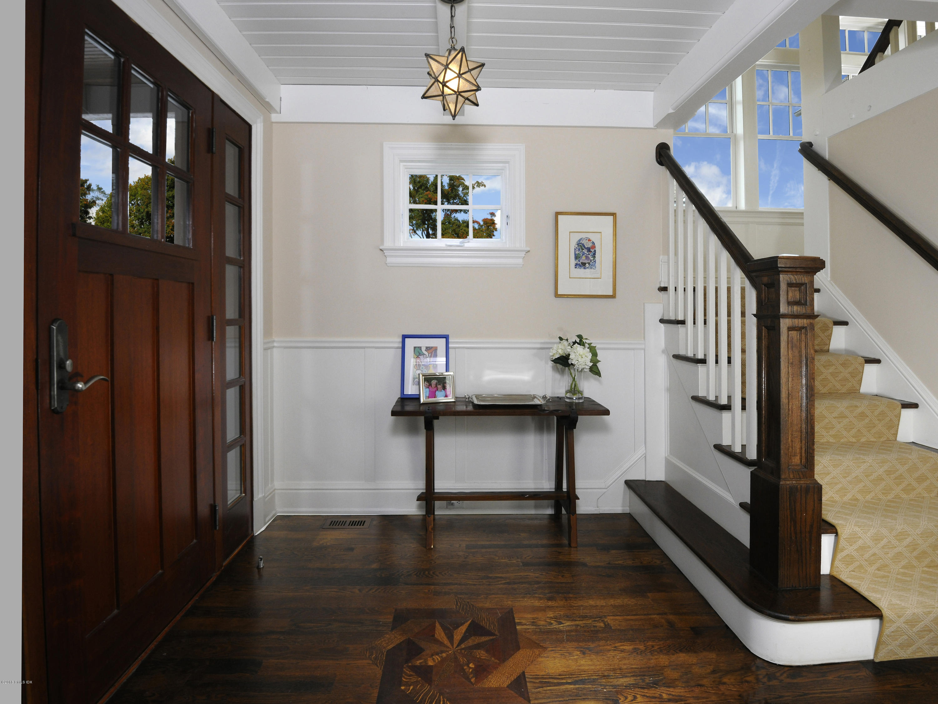 12 Ledge Road Old Greenwich, CT 06870 - Photo 4 of 34 a view of entryway with wooden floor and stairs