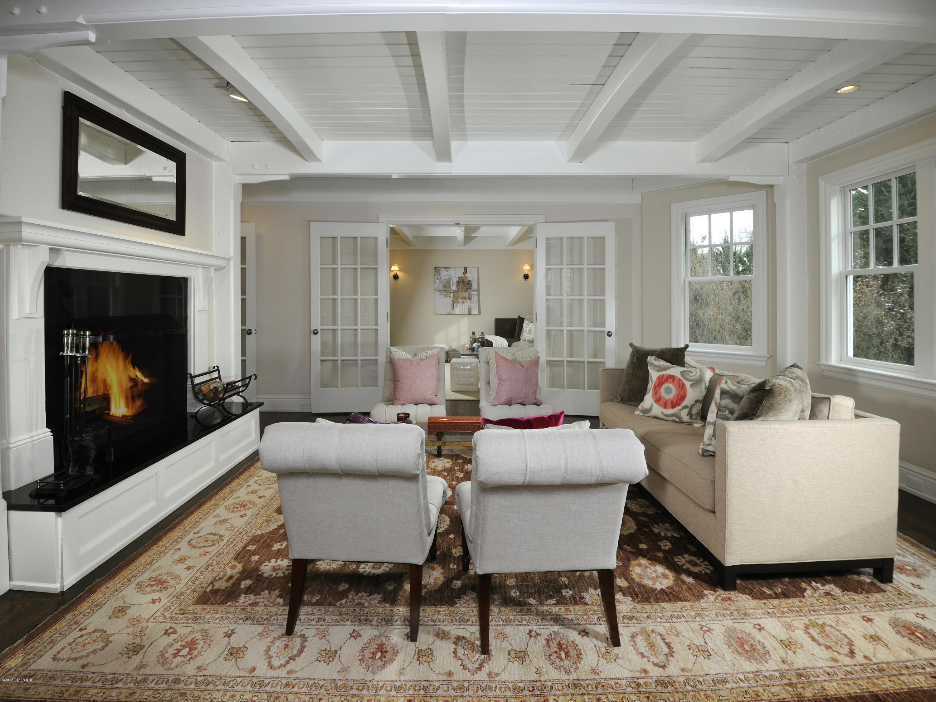 12 Ledge Road Old Greenwich, CT 06870 - Photo 7 of 34 a living room with furniture a flat screen tv and a fireplace