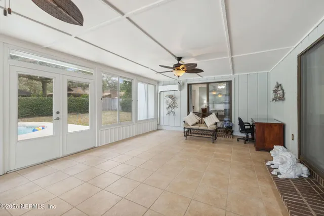 a view of a livingroom with furniture and a ceiling fan