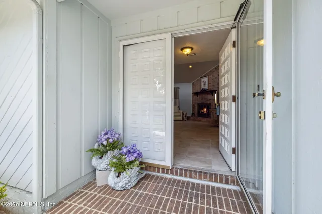 a view of a hallway and a dining room