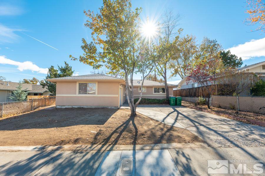 1355 Akard Drive Reno, NV 89503 - Photo 1 of 22 a view of a house with backyard and a tree
