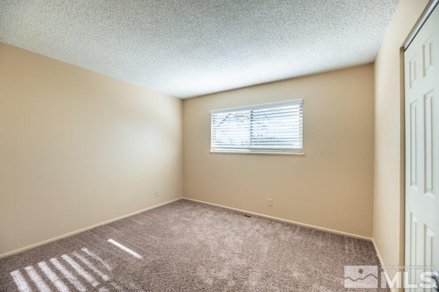 1355 Akard Drive Reno, NV 89503 - Photo 12 of 22 an empty room with windows