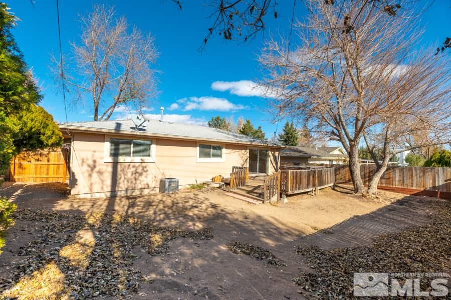 1355 Akard Drive Reno, NV 89503 - Photo 18 of 22 a view of a house with a yard covered in snow