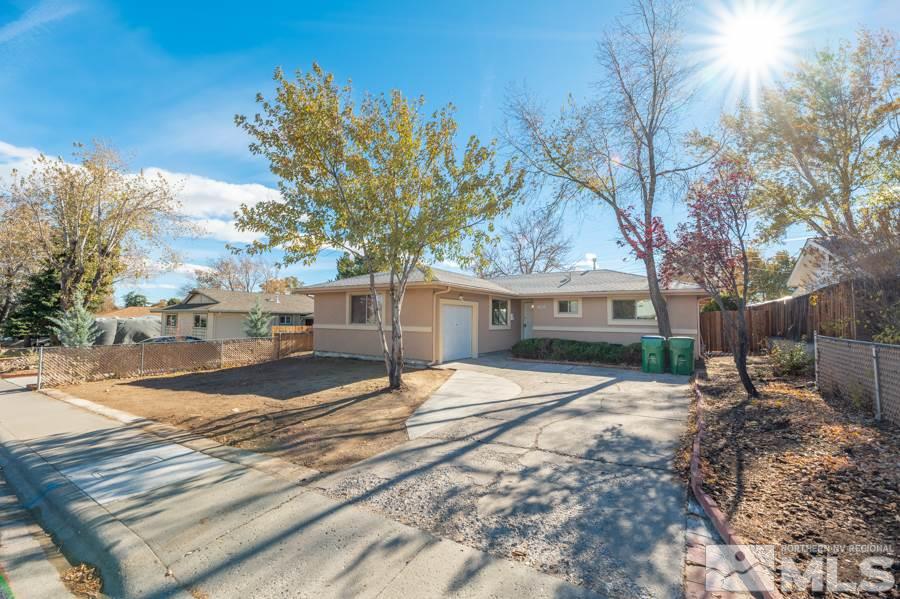 1355 Akard Drive Reno, NV 89503 - Photo 21 of 22 a view of a house with a tree in the background