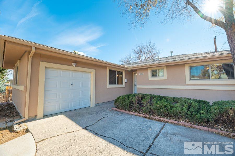 1355 Akard Drive Reno, NV 89503 - Photo 22 of 22 a front view of a house with a yard