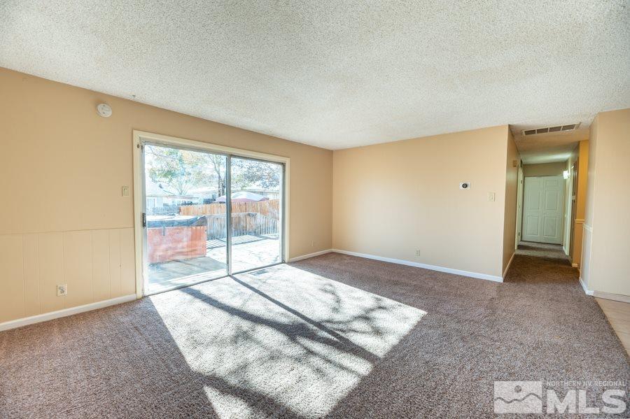 1355 Akard Drive Reno, NV 89503 - Photo 4 of 22 a view of an empty room and window