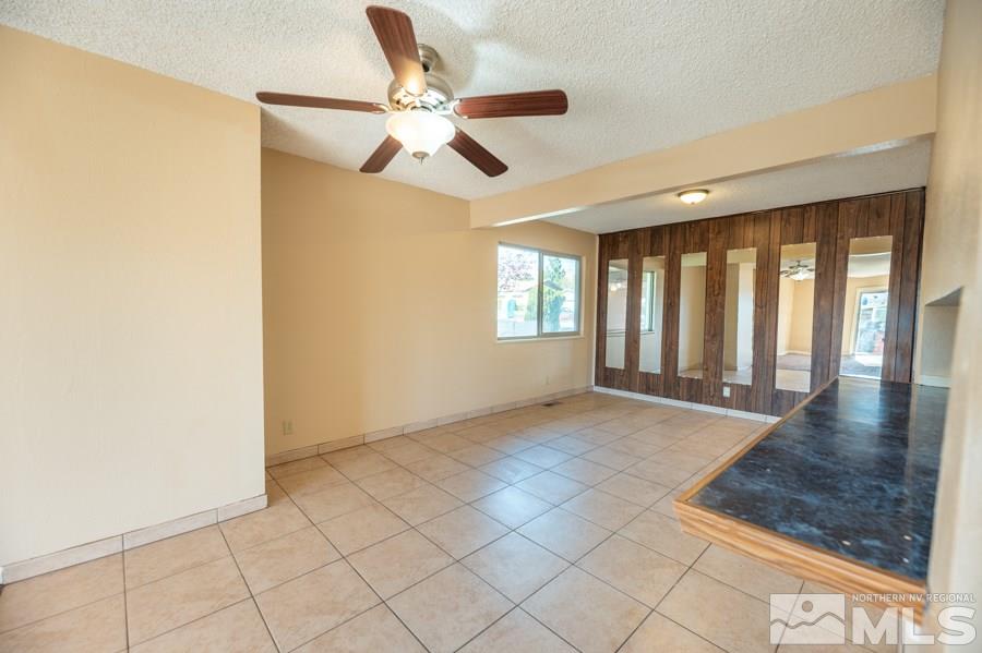 1355 Akard Drive Reno, NV 89503 - Photo 5 of 22 a view of an empty room with window and chandelier fan