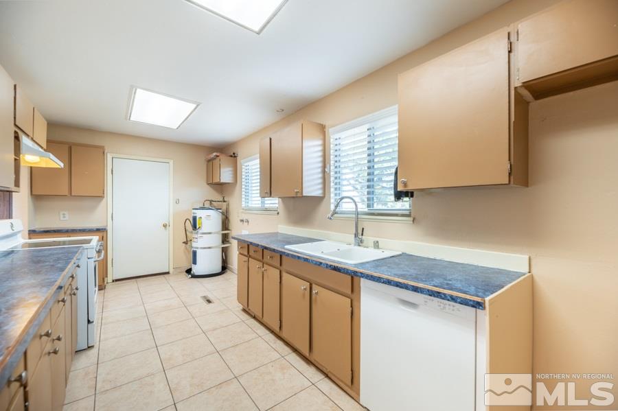 1355 Akard Drive Reno, NV 89503 - Photo 6 of 22 a kitchen with a sink stove and cabinets