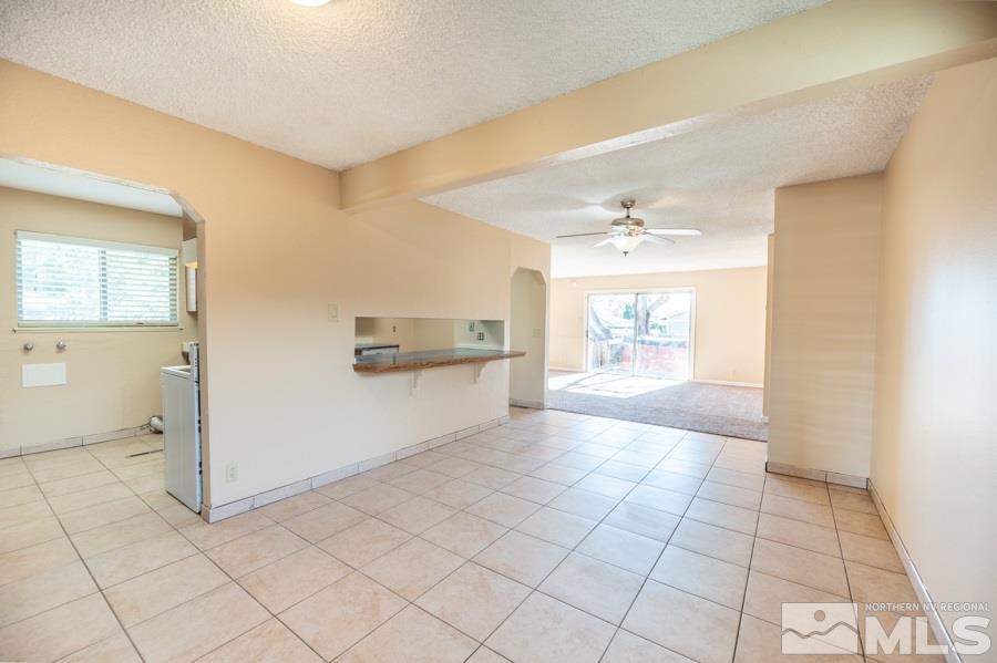 1355 Akard Drive Reno, NV 89503 - Photo 9 of 22 a view of a hallway to room with a window