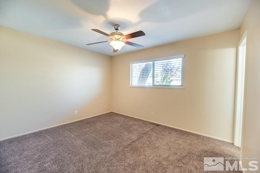 1355 Akard Drive Reno, NV 89503 - Photo 10 of 22 an empty room with windows and fan
