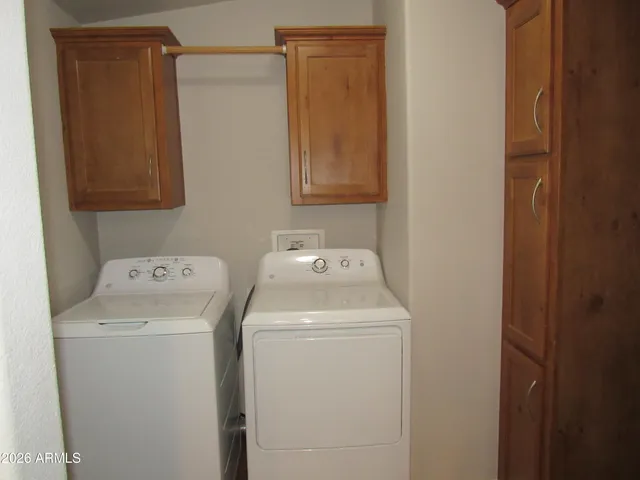 a view of a backyard house and swimming pool