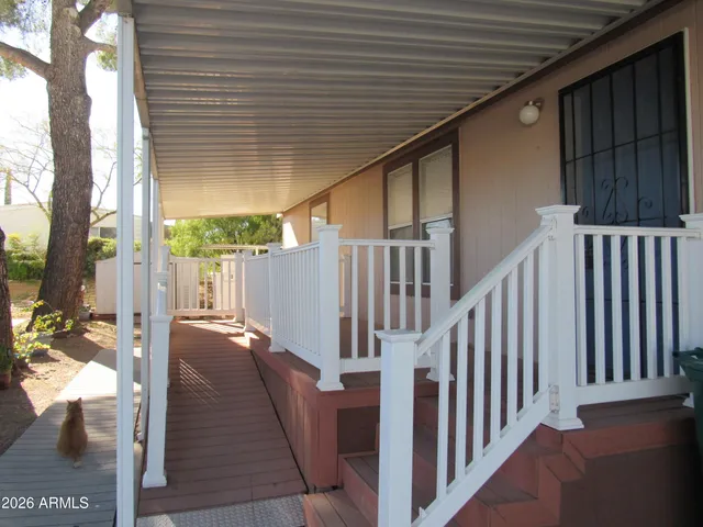 a view of a porch with wooden floor
