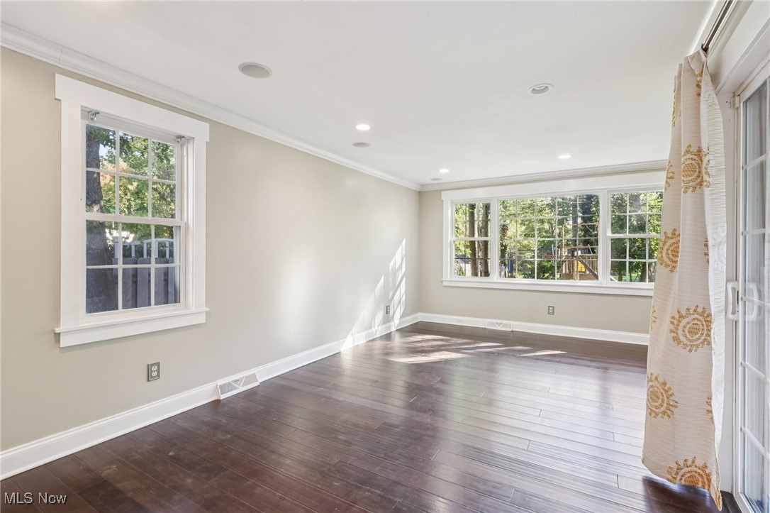 1151 Croyden Road Lyndhurst, OH 44124 - Photo 10 of 37 Empty room with ornamental molding, dark wood-type flooring, and recessed lighting
