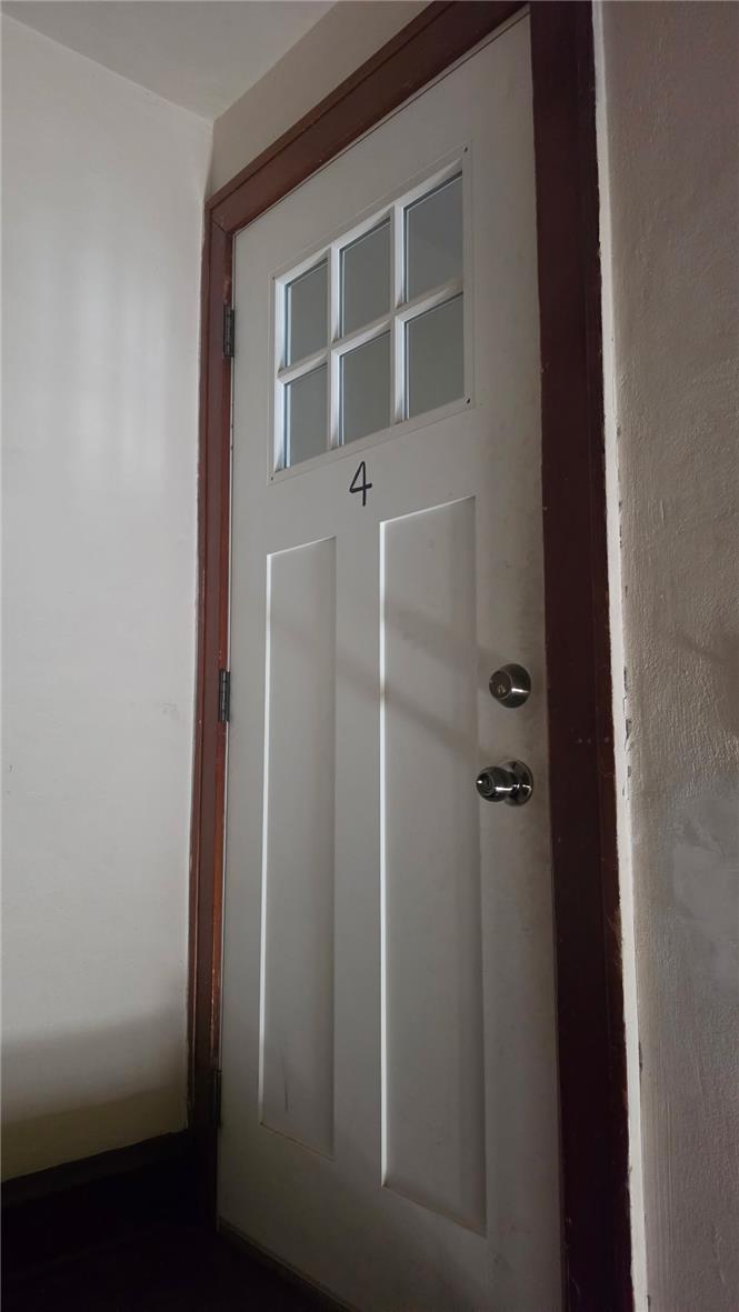 233 East Ridge Street Lansford, PA 18232 - Photo 9 of 10 Secure entry via a panel door with an integrated window grid, marking a distinct threshold.