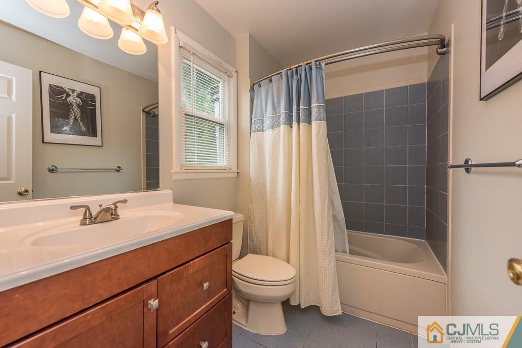 25 South Westfield Road Howell, NJ 07731 - Photo 11 of 22 a bathroom with a sink a toilet and shower