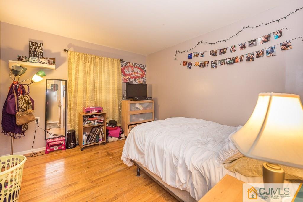 25 South Westfield Road Howell, NJ 07731 - Photo 15 of 22 a bedroom with a bed dresser and a window