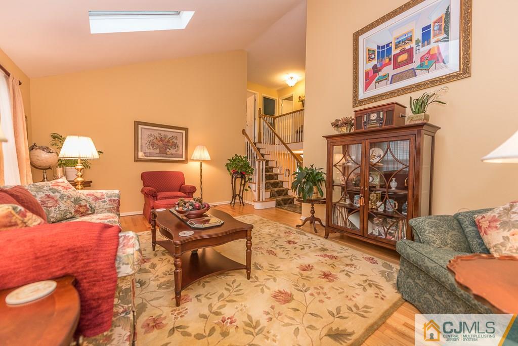25 South Westfield Road Howell, NJ 07731 - Photo 18 of 22 a living room with furniture and wooden floor