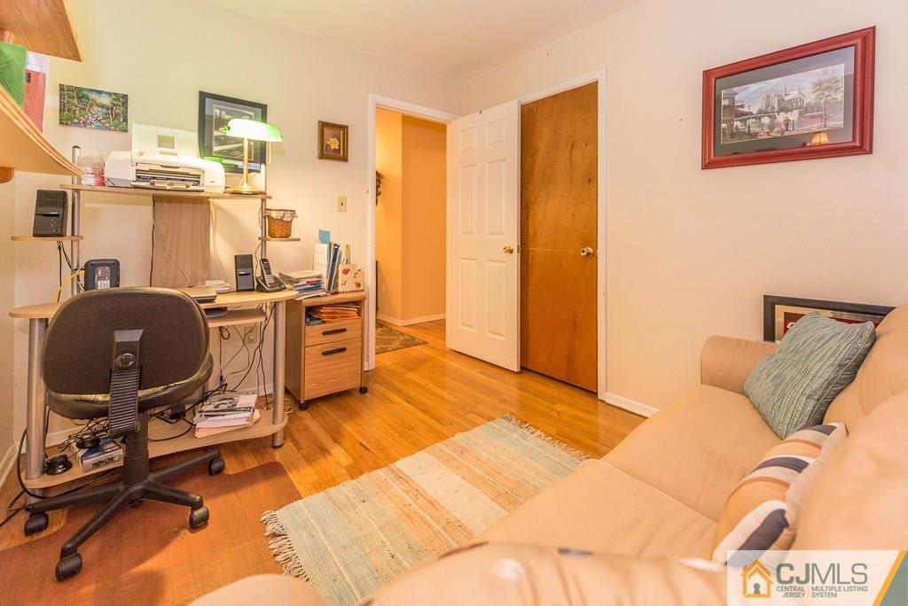 25 South Westfield Road Howell, NJ 07731 - Photo 19 of 22 a view of a workspace with furniture and a bedroom