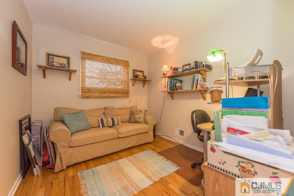 25 South Westfield Road Howell, NJ 07731 - Photo 20 of 22 a living room with furniture and wooden floor
