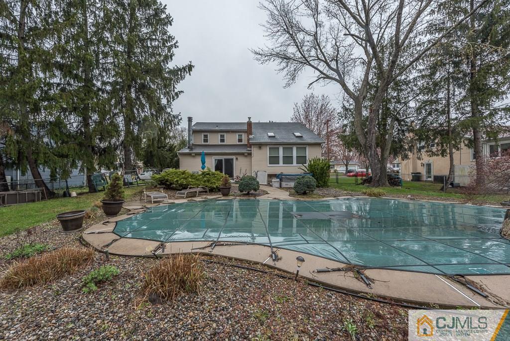 25 South Westfield Road Howell, NJ 07731 - Photo 21 of 22 a view of a lake with a house in the background