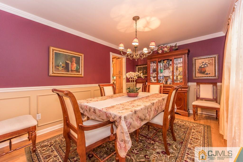 25 South Westfield Road Howell, NJ 07731 - Photo 4 of 22 a view of a dining room with furniture and chandelier