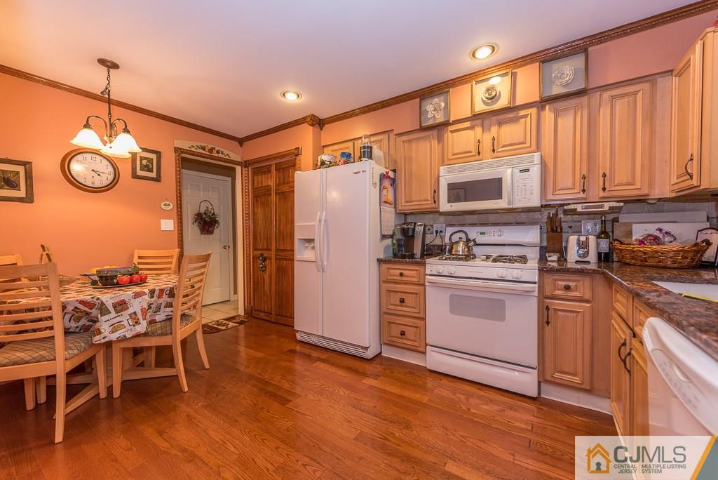 25 South Westfield Road Howell, NJ 07731 - Photo 7 of 22 a kitchen with stainless steel appliances granite countertop a refrigerator and microwave