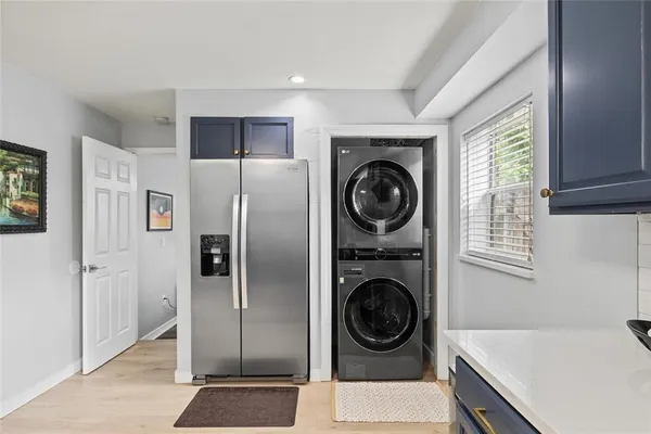a utility room with sink dryer and washer