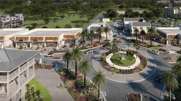 an aerial view of a house with swimming pool and outdoor seating